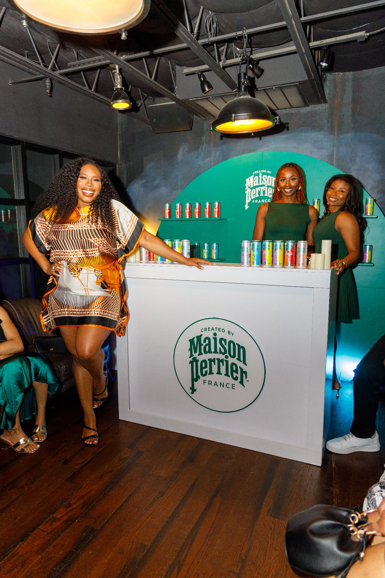 Guests photographed at a branded beverage bar during a launch event